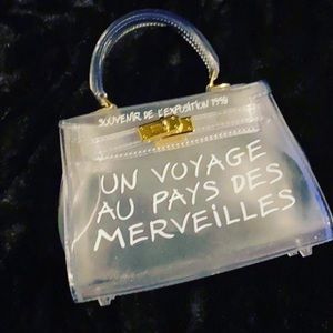 Un Voyage pvc handbag mini